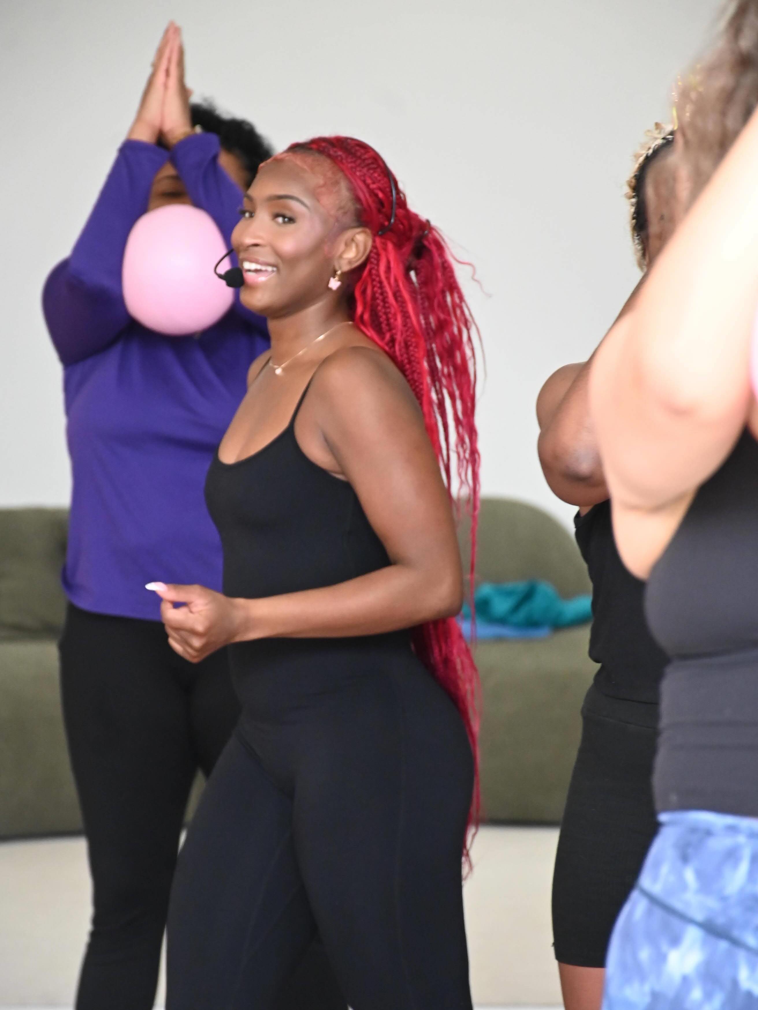 Nelle teaching a group Pilates session